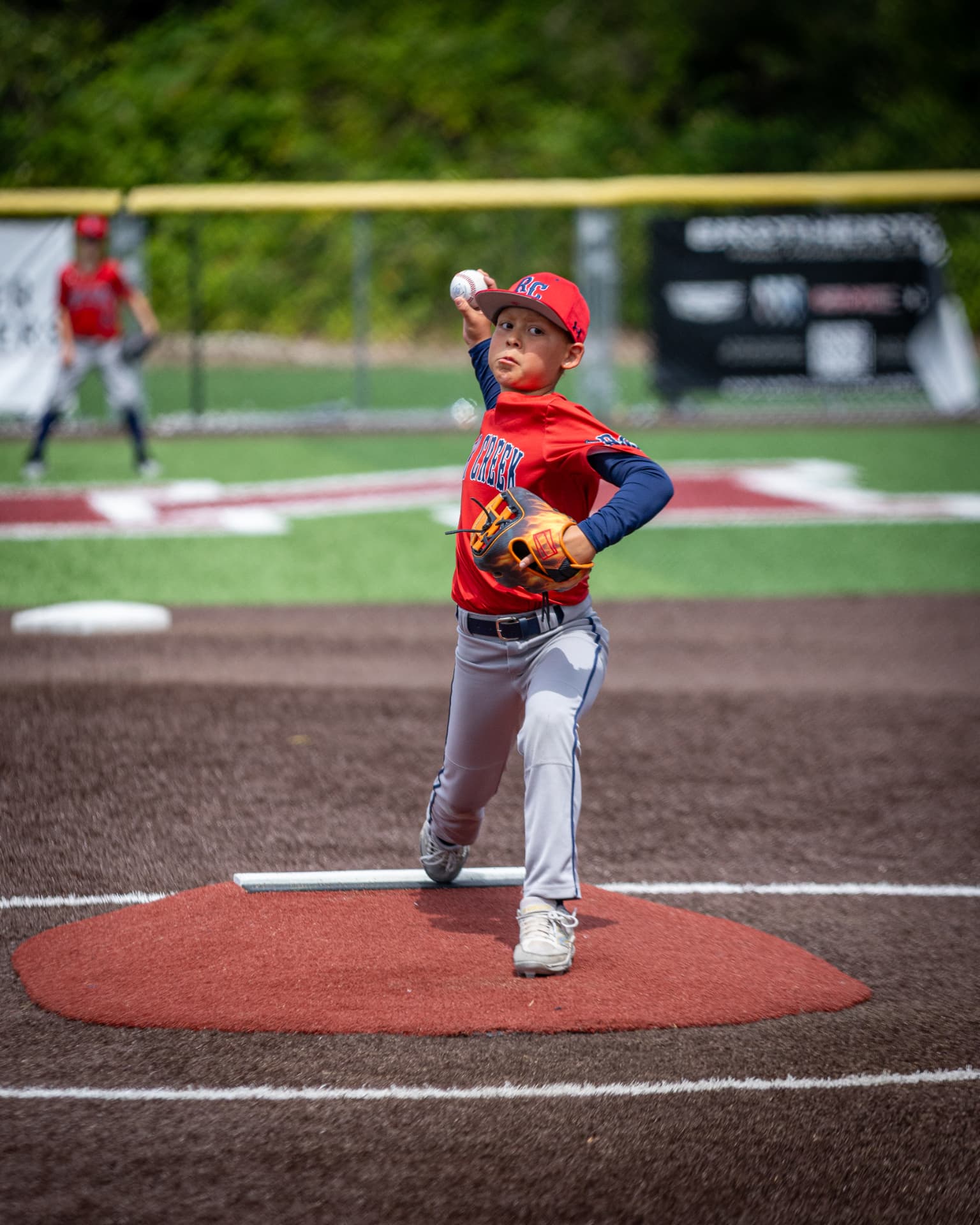 Kade delivering a pitch from the mound